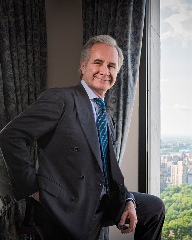 Man standing in an office by the window